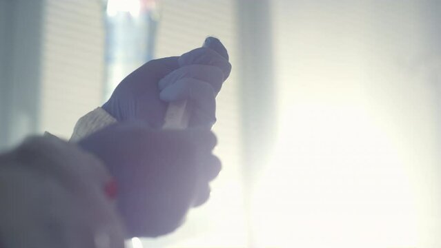 Doctor hands draw fluid for vaccination closeup. Medical therapy in hospital