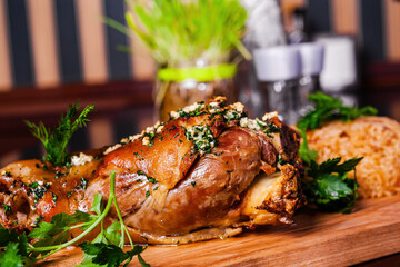 German style roasted pork hock (knuckle, shank) with rice on wooden cutting board