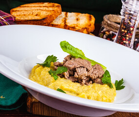 Beef Stroganoff with mashed potatoes on white plate