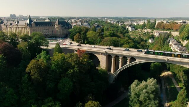 Establishing Aerial shot of Luxembourg City Skyline with Landmark Adolphe Bridge, Plateau Bourbon Architecture and Typical Cityscape. Tourism and Travel concept. 4K drone panoramic shot