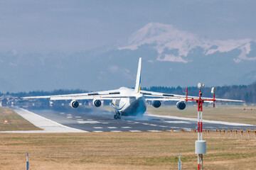 Huge cargo plane is approaching the runway and is about to land