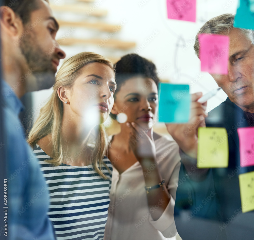 Poster taking business places with their creative talent. shot of a group of colleagues having a brainstorm