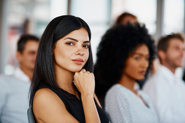 This has given me a lot to think about. Cropped portrait of an attractive young businesswoman sitting in the conference room during a seminar.