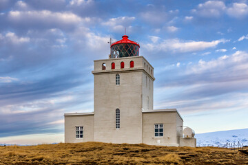 Fototapeta na wymiar The old lighthouse building at Dyrhólaey on the south coast of Iceland
