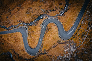 Aerial view on serpentine road on the island Streymoy near the village Nordradalur with view of...
