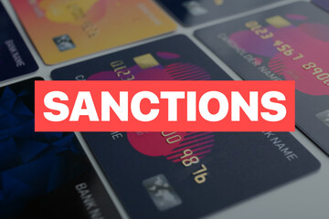 Many credit cards and word SANCTIONS, closeup