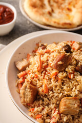 Plate of traditional pilaf on table, closeup