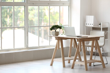 Interior of stylish room with modern workplace