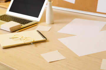 Blank sticky notes with paper sheets on table, closeup