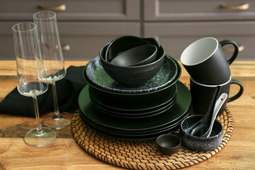 Set of clean tableware in kitchen