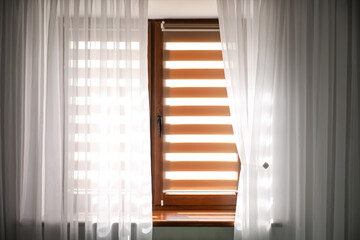 Window with roller blinds in modern room