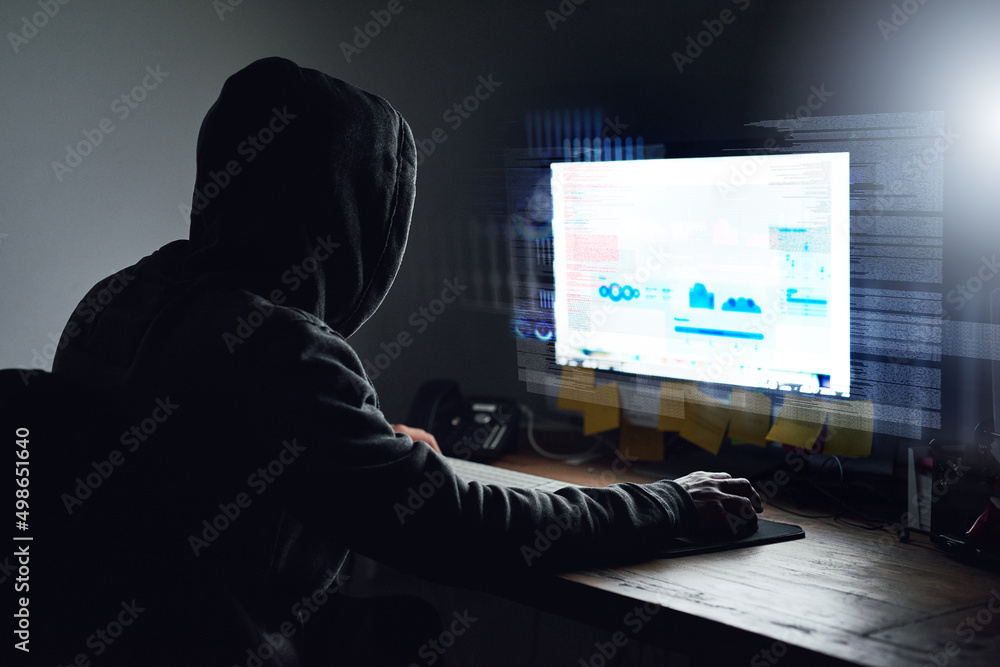 Aufkleber unraveling the code. rearview shot of a young programmer working on his computer late at night.