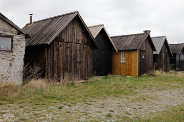 Fototapeta na wymiar Old sheds at the Helgumannen fishing station located on Faro island in the Swedish province of Gotland.