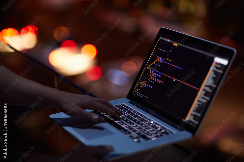 Poster He knows his way around any network. Shot of an unrecognisable hacker using a laptop in the dark.