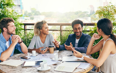 Figuring all their plans out. Shot of a group of businesspeople having a meeting outdoors.