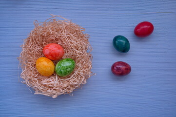 Directly above shot of Easter eggs against the blue background