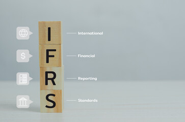wooden cubes IFRS International Financial Reporting Standards with on table and copy space.Business...
