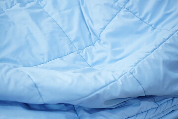 blue blanket background on the mattress         