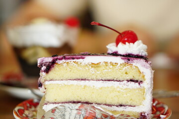 cake in glass cabinet cut into pieces Sold in a coffee shop