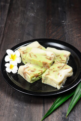 Puding roti tawar pandan or talam or steamed bread puding with pandan flavour.