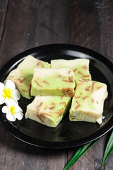 Puding roti tawar pandan or talam or steamed bread puding with pandan flavour.