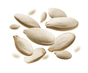 Pumpkin seeds levitate on a white background