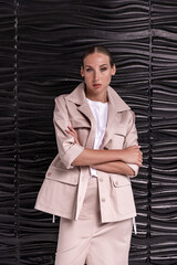 Businesswoman in office suit amid stylish workspace decor
