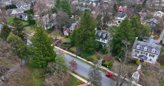 Upscale mansion homes in neighborhood in USA. American town in urban suburb area. Residential district aerial in spring.