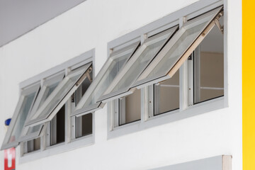 silver aluminium frame windows background, grey awning windows. modern home aluminium push windows....