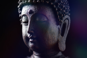 Obraz premium Meditating Buddha Statue on dark background. Soft focus. Close up. Copy space.