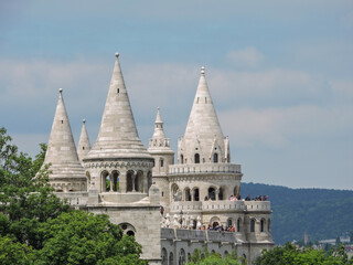 Fototapeta premium Budapest Hungary Old Fairy Tale Castle with Greenery Trees and Spires Close Detail