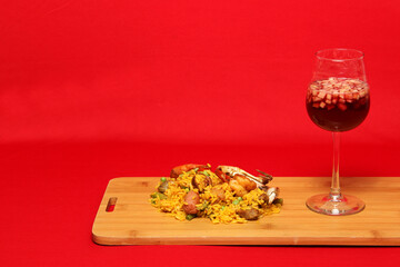 Paella rice with seafood traditional dish from Valencia Spain served on a white plate next to a...