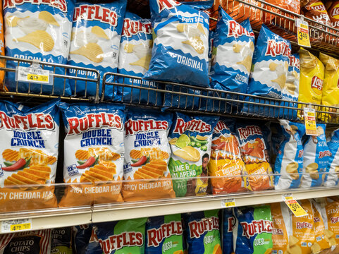 Woodinville, WA USA - circa April 2022: Angled view of Ruffles potato chips for sale in the snack food aisle of a Haggen grocery store