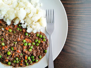 Minced and tatties with a fork on a plate. Traditional Scottish food.  Popular dish in Scotland.