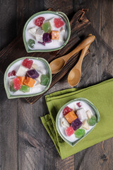 Bubur Cha Cha or chacha, Malaysian style coconut milk dessert with taro, sweet potato, yam, tapioca and a variety of condiments