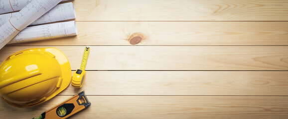 Work safety. Standard Construction site protective equipment on  top view wooden background, flat lay, copy space,safety first concepts.