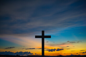 The Cross at the sunset background