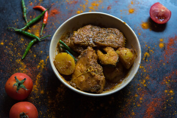 Bengali dish fish kalia or masala curry served in a bowl. Close up, selective focus.
