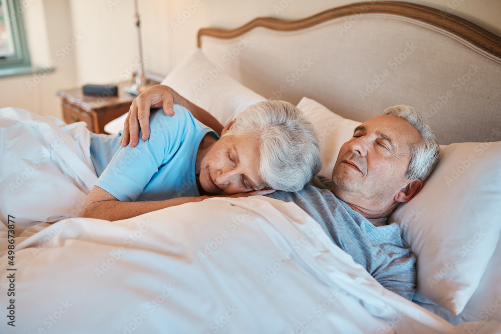 Poster Ive listened to this heartbeat for years. Cropped shot of an affectionate senior couple cuddling each other while asleep in bed at a nursing home.