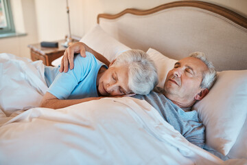 Ive listened to this heartbeat for years. Cropped shot of an affectionate senior couple cuddling each other while asleep in bed at a nursing home.