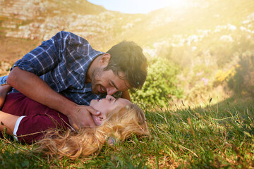 Fototapeta premium I could kiss you all day. Shot of an affectionate young couple enjoying a day outdoors.