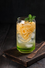 Es Blewah. Indonesian cold fruity drink of cantaloupe strips with syrup, basil seeds on top;