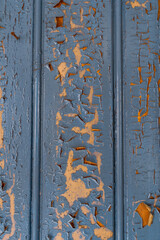 cracked blue paint on the panel in an old living room