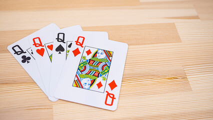 Playing cards lined up on the desk_13
