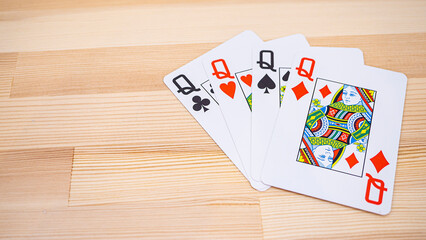 Playing cards lined up on the desk_14