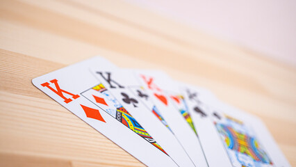 Playing cards lined up on the desk_16