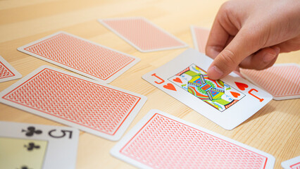 Playing cards lined up on the desk_32