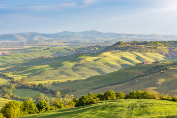 Fototapeta na wymiar Tuscan countryside rolling landscape view with valleys and fields
