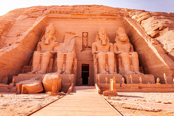 Statue of Seated Ramses II at the Great Ramses II Temple in Abu Simbel Village. - obrazy, fototapety, plakaty