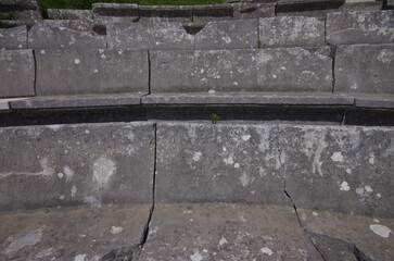 Detail of the stone seats of the Samnite Theater of Pietrabbondante. Molise - Italy